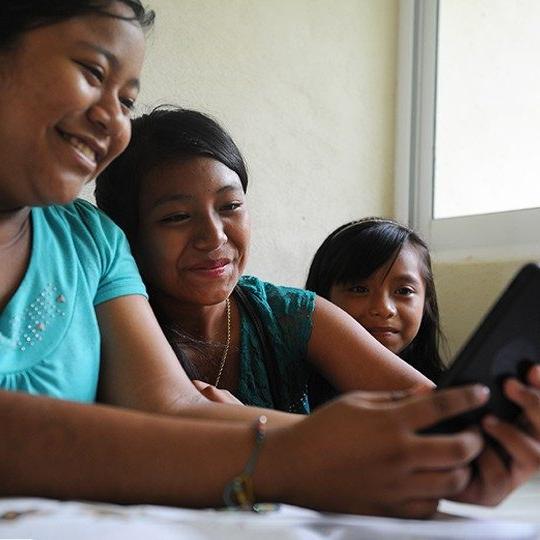 Yound women connect through community wi-fi